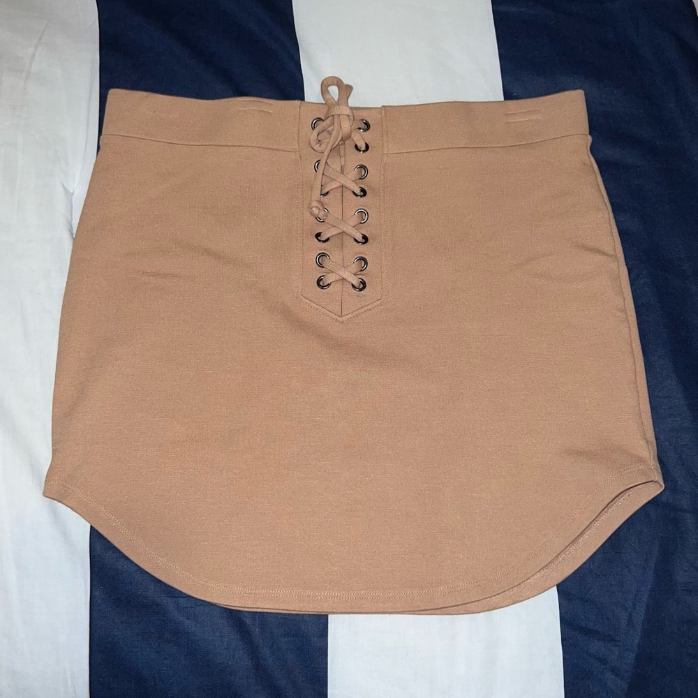 Curved Hem Nude Lace Up Miniskirt